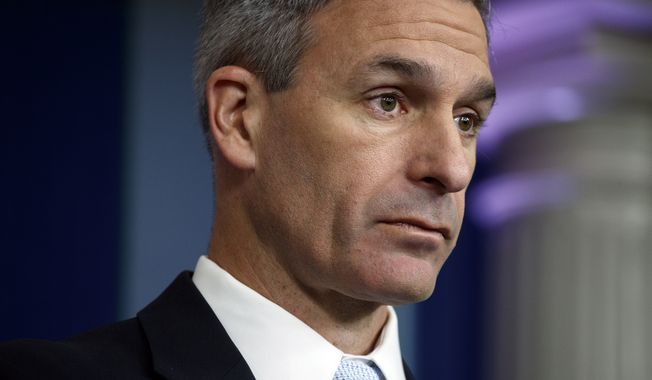 Acting Director of United States Citizenship and Immigration Services Ken Cuccinelli, listens to a question during a briefing at the White House, Monday, Aug. 12, 2019, in Washington. (AP Photo/Evan Vucci)