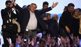 Presidential candidate Alberto Fernandez addresses supporters at the &amp;quot;Frente de Todos&amp;quot; party headquarters after primary elections in Buenos Aires, Argentina, Sunday, Aug. 11, 2019. The &amp;quot;Frente de Todos&amp;quot; presidential ticket with former President Cristina Fernández emerged as the strongest vote-getter in Argentina’s primary elections Sunday, indicating conservative President Mauricio Macri will face an uphill battle going into general elections in October. (AP Photo/Sebastian Pani)