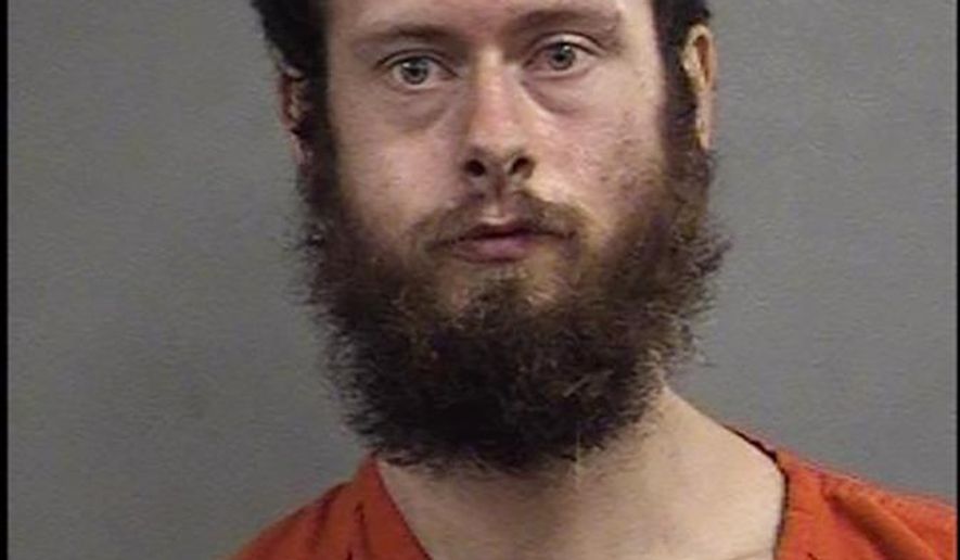 In this undated photo released by the Louisville Metro Corrections, Cane L. Madden poses for a booking photo, in Louisville, Ky. Police say 29-year-old Madden hit an 8-year-old girl in the head with a shovel, fracturing her skull, and then raped and robbed her. (Louisville Metro Corrections via AP)