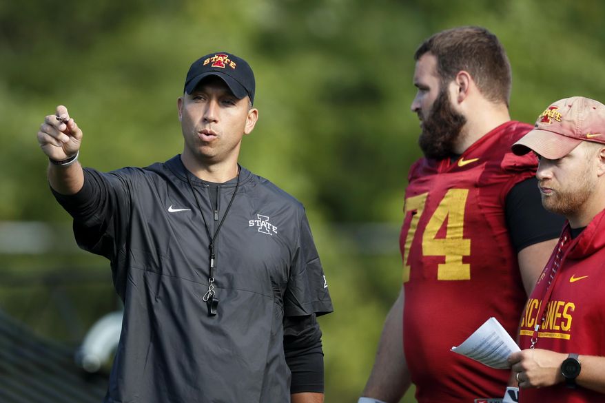 FILE - In this Aug. 2, 2019, file photo, Iowa State coach Matt Campbell, left, talks with offensive lineman Bryce Meeker (74) during an NCAA college football practice, in Ames, Iowa. (AP Photo/Charlie Neibergall, File)