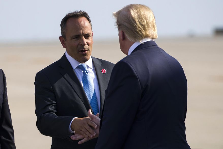 FILE - In a Thursday, Aug. 1, 2019 file photo, Gov. Matt Bevin, R-Ky., greets President Donald Trump as he steps off Air Force One at Cincinnati/Northern Kentucky International Airport, in Hebron, Ky., to speak at a campaign rally in Cincinnati. Gov. Matt Bevin’s campaign says President Donald Trump will headline a fundraiser in support of the Republican governor’s reelection campaign on Aug. 21 in Louisville. (AP Photo/Alex Brandon, File)