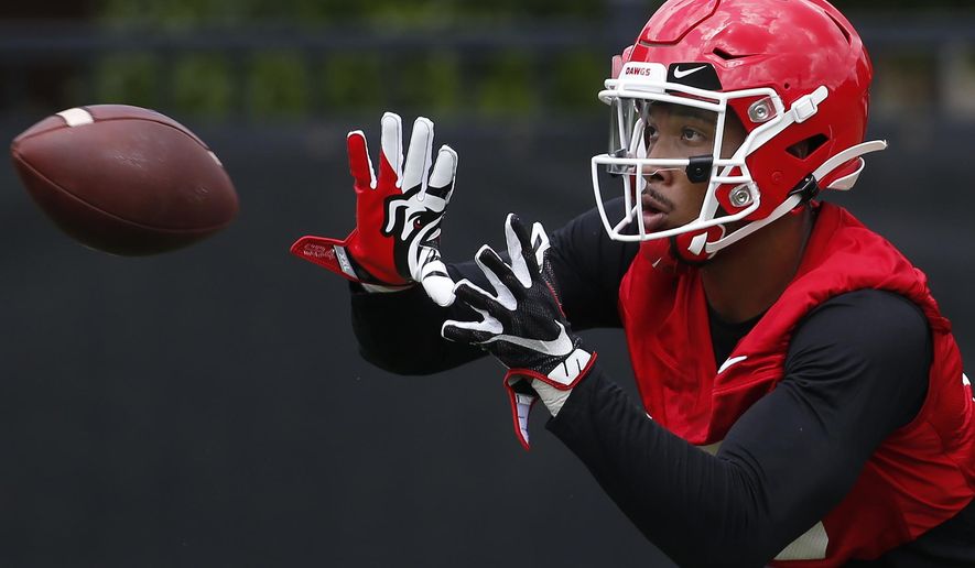 FILE - In this Aug. 2, 2019, file photo, Georgia wide receiver Lawrence Cager looks to bring a catch during an NCAA football preseason practice in Athens, Ga. Cager left Miami after catching 21 passes for 374 yards and six touchdowns. Georgia has lost its top five receivers from last year, so Cager will have plenty of opportunity to make an impact. (Joshua L. Jones/Athens Banner-Herald via AP)