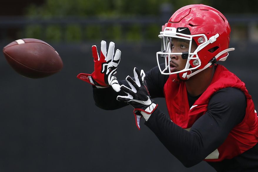 FILE - In this Aug. 2, 2019, file photo, Georgia wide receiver Lawrence Cager looks to bring a catch during an NCAA football preseason practice in Athens, Ga. Cager left Miami after catching 21 passes for 374 yards and six touchdowns. Georgia has lost its top five receivers from last year, so Cager will have plenty of opportunity to make an impact. (Joshua L. Jones/Athens Banner-Herald via AP)