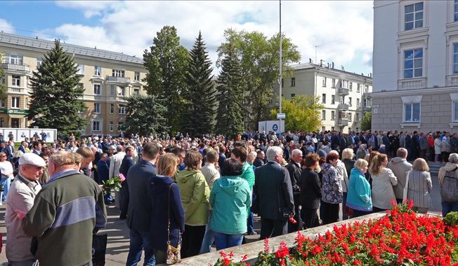 In this grab taken from a footage provided by the Russian State Atomic Energy Corporation ROSATOM press service, people gather for the funerals of five Russian nuclear engineers killed by a rocket explosion in Sarov, the closed city, located 370 kilometers (230 miles) east of Moscow, Monday, Aug. 12, 2019. Thousands of people have attended the burial of five Russian nuclear engineers killed by an explosion during tests of a new rocket. The engineers, who died on Thursday, were laid to rest Monday in the city of Sarov that hosts Russia’s main nuclear weapons research center. (Russian State Atomic Energy Corporation ROSATOM via AP)
