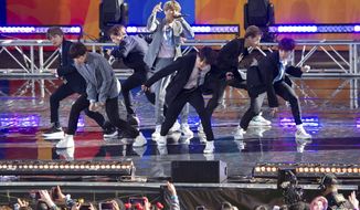FiLE - In this May 15, 2019, file photo, South Korean boy band BTS perform on ABC&#39;s &amp;quot;Good Morning America at Rumsey Playfield/SummerStage in Central Park, in New York. The agency for K-pop superstars BTS says the singers will take an extended break from showbiz to rest and relax and “enjoy the ordinary lives of young people in their 20s, albeit briefly.” Big Hit Entertainment said a concert on Monday, Aug. 12, 2019, in Seoul was group’s last scheduled event before the seven members go on “vacations” for the first time since their 2013 debut. (Photo by Scott Roth/Invision/AP, File)