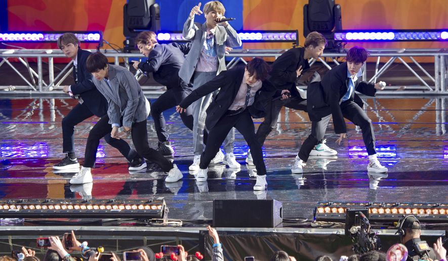 FiLE - In this May 15, 2019, file photo, South Korean boy band BTS perform on ABC&#x27;s &amp;quot;Good Morning America at Rumsey Playfield/SummerStage in Central Park, in New York. The agency for K-pop superstars BTS says the singers will take an extended break from showbiz to rest and relax and “enjoy the ordinary lives of young people in their 20s, albeit briefly.” Big Hit Entertainment said a concert on Monday, Aug. 12, 2019, in Seoul was group’s last scheduled event before the seven members go on “vacations” for the first time since their 2013 debut. (Photo by Scott Roth/Invision/AP, File)