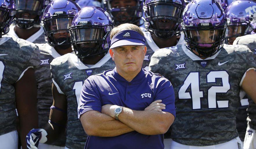 FILE - In this Saturday, Sept. 1, 2018, file photo, TCU head coach Gary Patterson stands with his team in the tunnel exit before running onto the field for an NCAA college football game against Southern University in Fort Worth, Texas. Coach Patterson is entering his 19th season at TCU coming off a 7-6 record that included an impressive late comeback, winning their last two regular season games just to get bowl eligible, and then won that game, after a season filled with injuries to so many key players. On defense, they have to replace three NFL draft picks. (AP Photo/Ron Jenkins, File)