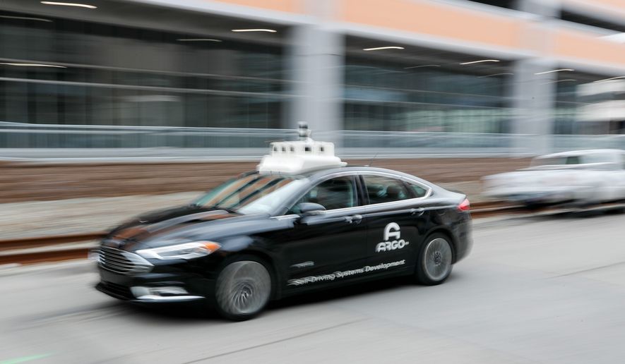 Most women said they were fearful of being in a driverless car, an AAA survey found. Some 79% of women said they would be fearful of riding inside such a vehicle.
In this Jan. 4, 2019, photo made with a slow shutter speed, one of the test vehicles from Argo AI, Ford&#39;s autonomous vehicle unit, navigates through the strip district near the company offices in Pittsburgh. The people developing self-driving vehicles say it could be anywhere from 10 years to decades before the cars will be carrying passengers in every city. Researchers are trying to conquer a number of obstacles. (AP Photo/Keith Srakocic) (ASSOCIATED PRESS)