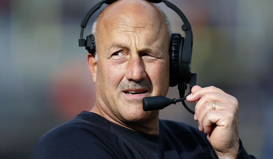 FILE - In this Oct. 13, 2018, Boston College head coach Steve Addazio talks on his headset during the second half of an NCAA college football game against Louisville in Boston. (AP Photo/Michael Dwyer, File)