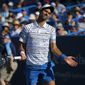 Novak Djokovic, of Serbia, reacts after giving up a point to Sam Querrey, of the United States, at the Western &amp;amp; Southern Open tennis tournament in Mason, Ohio, Tuesday, Aug. 13, 2019. (Sam Greene/The Cincinnati Enquirer via AP)