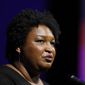 File- This July 22, 2019, file photo shows former Georgia House Minority Leader Stacey Abrams addressing the 110th NAACP National Convention,  in Detroit. Abrams is set to announce a multimillion-dollar initiative to staff and fund voter protection teams in battleground states across the country ahead of the 2020 elections. An aide familiar with the decision said she&#39;ll focus on the new program rather than run for president herself. The aide said Abrams would announce the initiative Tuesday, Aug. 13, 2019, during a speech before a labor union convention in Las Vegas.(AP Photo/Carlos Osorio, File)