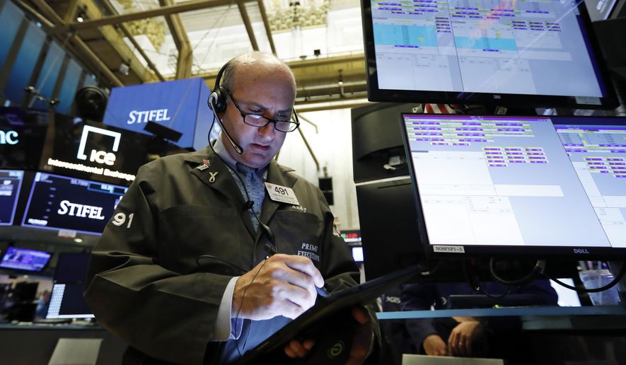 FILE - In this Aug. 6, 2019, file photo trader Andrew Silverman works on the floor of the New York Stock Exchange. The U.S. stock market opens at 9:30 a.m. EDT on Tuesday, Aug. 13. (AP Photo/Richard Drew, File)