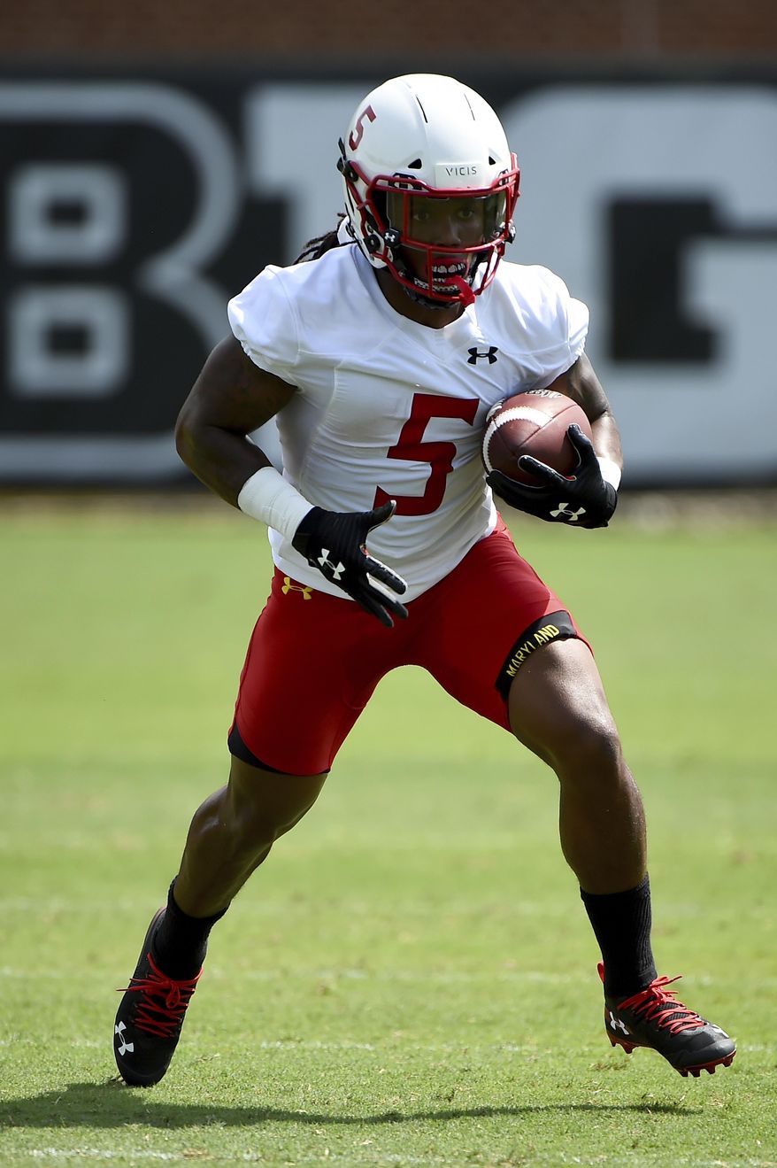 FILE - In this Aug. 2, 2019, file photo, Maryland running back Anthony McFarland works out during an NCAA college football training camp in College Park, Md. Coming off the darkest season in the history of the Maryland football program, the Terrapins are poised to enter a new era under Mike Locksley, hired in December after a successful run as Alabama's offensive coordinator, who remembers what it was like when the team competed for conference titles and counted on playing in bowl games. (AP Photo/Will Newton, File)