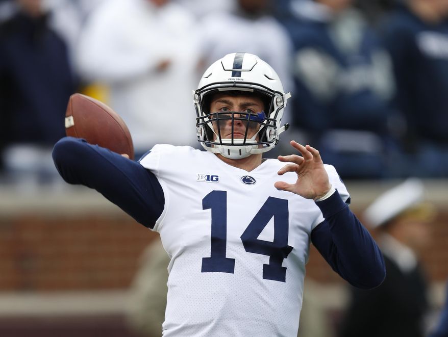 FILE - In this Nov. 3, 2018, file photo, Penn State quarterback Sean Clifford (14) warms up before an NCAA college football game against Michigan in Ann Arbor, Mich. Clifford always planned to be Penn State’s starting quarterback. The opportunity came sooner than even he expected. Clifford has huge task in replacing Trace McSorley, but he sounds and looks the part. (AP Photo/Paul Sancya, File)