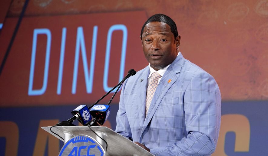 FILE - In this July 17, 2019, file photo, Syracuse head coach Dino Babers speaks during the Atlantic Coast Conference NCAA college football media day in Charlotte, N.C. Babers begins his fourth season at Syracuse with one main goal _ to prove that last season was no fluke.  Syracuse finished 10-3 in 2018, second to national champion Clemson in the Atlantic Coast Conference&#39;s tough Atlantic Division, and was No. 15 in the AP&#39;s final poll.(AP Photo/Chuck Burton, File)
