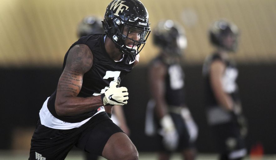 Wake Forest wide receiver Scotty Washington runs a route during the first day of NCAA college football practice in Winston-Salem, N.C., Thursday, Aug. 1, 2019. (Walt Unks/Winston-Salem Journal via AP)