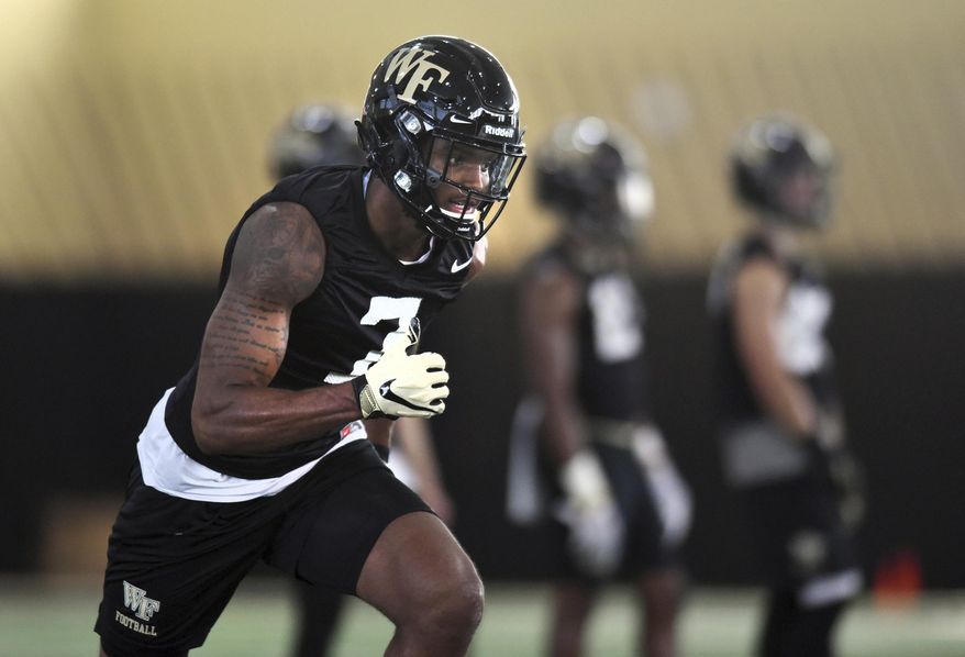 Wake Forest wide receiver Scotty Washington runs a route during the first day of NCAA college football practice in Winston-Salem, N.C., Thursday, Aug. 1, 2019. (Walt Unks/Winston-Salem Journal via AP)