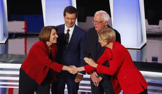 Sen. Amy Klobuchar, D-Minn., from left, South Bend Mayor Pete Buttigieg, Sen. Bernie Sanders, I-Vt., and Sen. Elizabeth Warren, D-Mass., greet each other before the first of two Democratic presidential primary debates hosted by CNN Tuesday, July 30, 2019, in the Fox Theatre in Detroit. (AP Photo/Paul Sancya) ** FILE **
