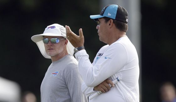 Buffalo Bills coach Sean McDermott, left, and Carolina Panthers coach Ron Rivera chat during an NFL football training camp in Spartanburg, S.C., Wednesday, Aug. 14, 2019. (AP Photo/Gerry Broome) **FILE**