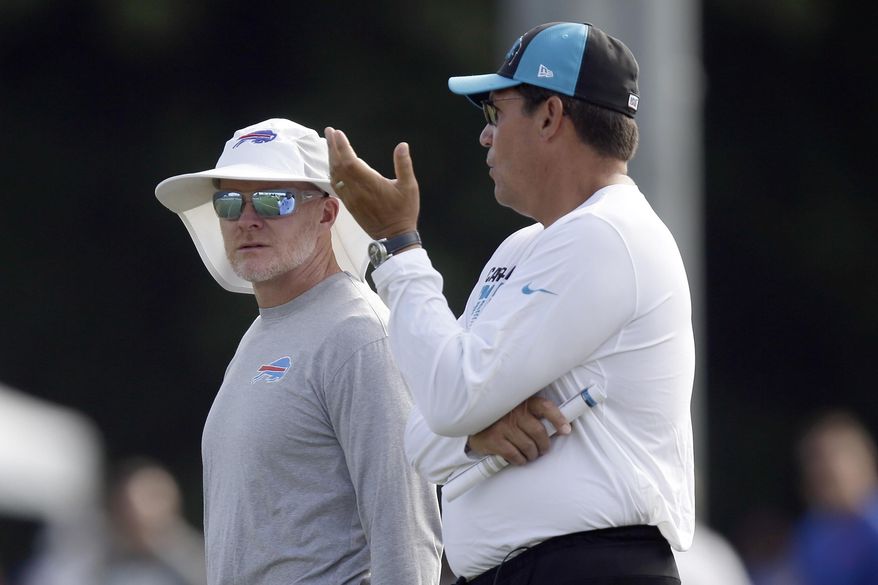 Buffalo Bills coach Sean McDermott, left, and Carolina Panthers coach Ron Rivera chat during an NFL football training camp in Spartanburg, S.C., Wednesday, Aug. 14, 2019. (AP Photo/Gerry Broome) **FILE**