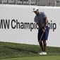 Tiger Woods chips an approach shot on the 12th hole during the pro-am round of the BMW Championship golf tournament at Medinah Country Club, Wednesday, Aug. 14, 2019, in Medinah, Ill. (AP Photo/Nam Y. Huh)