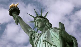 In this June 2, 2009, file photo, the Statue of Liberty stands in New York harbor. (AP Photo/Richard Drew, File)