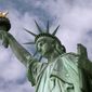 In this June 2, 2009, file photo, the Statue of Liberty stands in New York harbor. (AP Photo/Richard Drew, File)