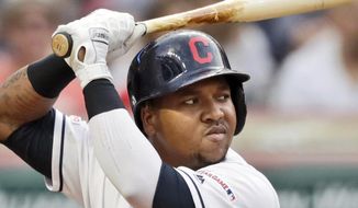 FILE - In this Aug. 12, 2019, file photo, Cleveland Indians&#39; Jose Ramirez bats against the Boston Red Sox in the third inning of a baseball game, in Cleveland. The Indians’ clubhouse is buzzing like always three hours prior to a three-game series opener against the Boston Red Sox, whose World Series defense isn’t going particularly well right now. (AP Photo/Tony Dejak, File)