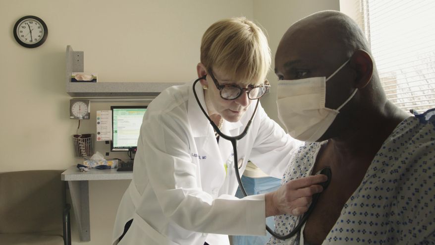 This photo provided by Netflix shows Dr. Lisa Sanders examining a patient in a scene from the new Netflix series “Diagnosis,” which transports Sanders’ column from the pages of The New York Times to television. The show, which is available starting Friday, Aug. 16, 2019, harnesses the internet and social media to diagnose unusual cases. (Netflix via AP)