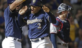 Milwaukee Brewers&#39; Trent Grisham(2) reacts to his three-run home run against the Minnesota Twins during the eighth inning of a baseball game Wednesday, Aug. 14, 2019, in Milwaukee. (AP Photo/Jeffrey Phelps)
