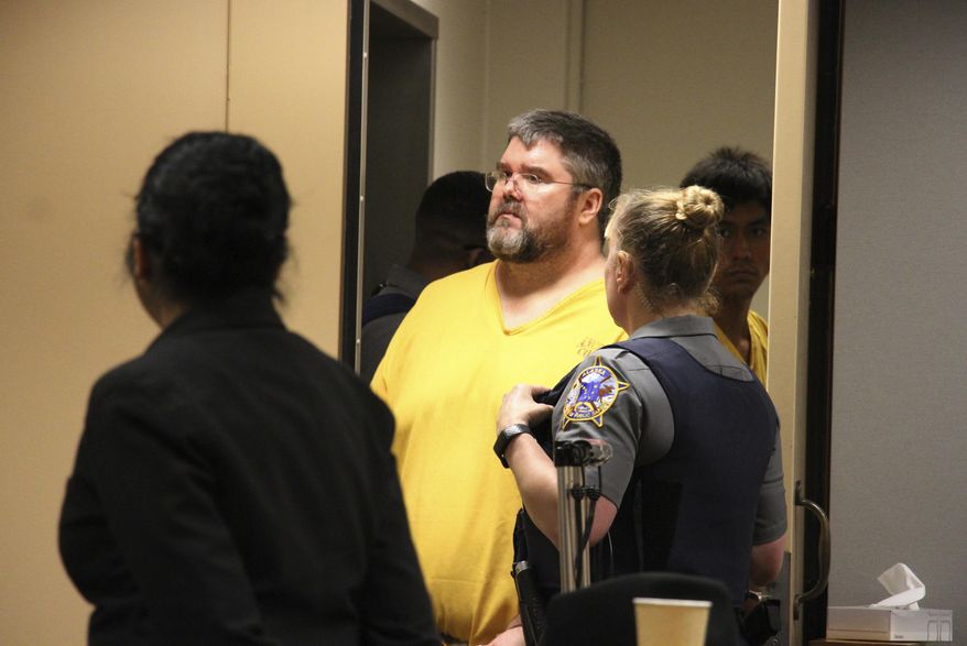File - In this Aug. 6, 2019, file photo, Steven Downs is led into a courtroom for arraignment in Anchorage, Alaska.Downs has pleaded not guilty after being charged in the sexual assault and murder of a woman in Alaska in a case that remained unsolved for years. Downs entered his plea Wednesday, Aug. 14, 2019, in a courtroom in Fairbanks, Alaska. He is charged in the death of Sophie Sergie, who was found stabbed and shot in a bathtub at a University of Alaska Fairbanks dormitory. (AP Photo/Mark Thiessen, File)