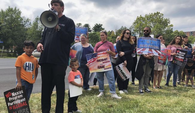 Nexus Services President Mike Donovan speaks at a rally in Falls Church, Va., Thursday, Aug. 15, 2019, to respond to a lawsuit alleging his company charges excessive fees to help detained immigrants obtain bail as they await hearings in immigration court. (AP Photo/Barakat Matthew)