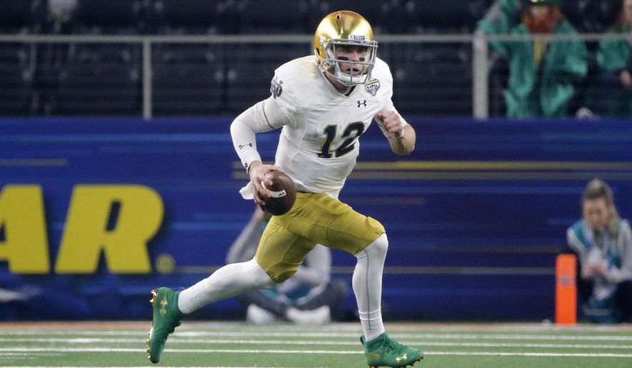 FILE - In this Dec. 29, 2018, file photo, Notre Dame quarterback Ian Book (12) runs the ball against Clemson during the NCAA Cotton Bowl semifinal playoff football game, in Arlington, Texas. Upon his return to campus last winter, Book immediately worked on his leadership skills and also making the difficult and tight downfield passes. Book was rewarded when he was named one of the team’s seven captains. (AP Photo/Michael Ainsworth, File)