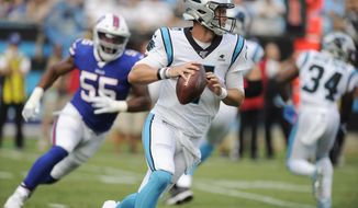 Carolina Panthers quarterback Kyle Allen (7) runs out of the pocket against the Buffalo Bills during the first half an NFL preseason football game, Friday, Aug. 16, 2019, in Charlotte, N.C. (AP Photo/Mike McCarn)