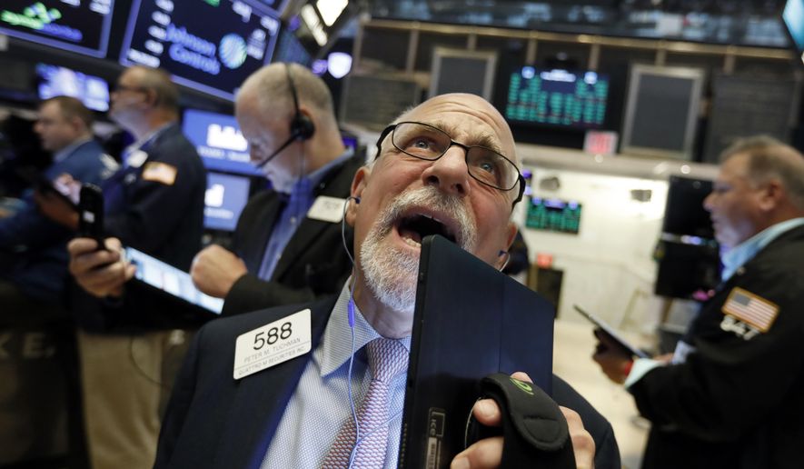 Trader Peter Tuchman works on the floor of the New York Stock Exchange, Friday, Aug. 16, 2019. Stocks are opening broadly higher at the end of a turbulent week. (AP Photo/Richard Drew)