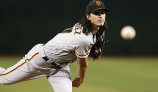 San Francisco Giants&#39; Dereck Rodriquez delivers a pitch against the Arizona Diamondbacks during the first inning of a baseball game Thursday, Aug. 15, 2019, in Phoenix. (AP Photo/Darryl Webb)