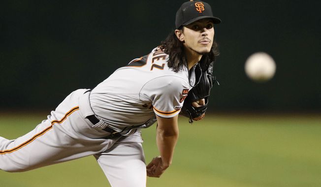 San Francisco Giants&#x27; Dereck Rodriquez delivers a pitch against the Arizona Diamondbacks during the first inning of a baseball game Thursday, Aug. 15, 2019, in Phoenix. (AP Photo/Darryl Webb)