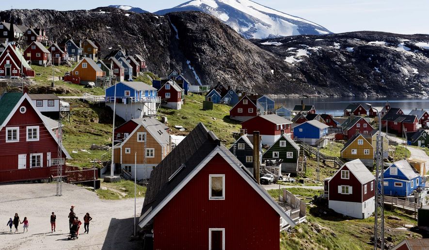 This July 11, 2015 file photo shows a general view of the town of Upernavik in western Greenland. Aiming to put his mark on the world map, President Donald Trump has talked to aides and allies about buying Greenland for the U.S. A Trump ally told The Associated Press on Thursday, Aug. 15, 2019 that the president had discussed the purchase but was not serious about it. And a Republican congressional aide said Trump brought up the notion of purchasing Greenland in conversations with lawmakers enough times to make them wonder, but they have not taken his comments seriously. (Linda Kastrup/Ritzau Scanpix via AP) **FILE**