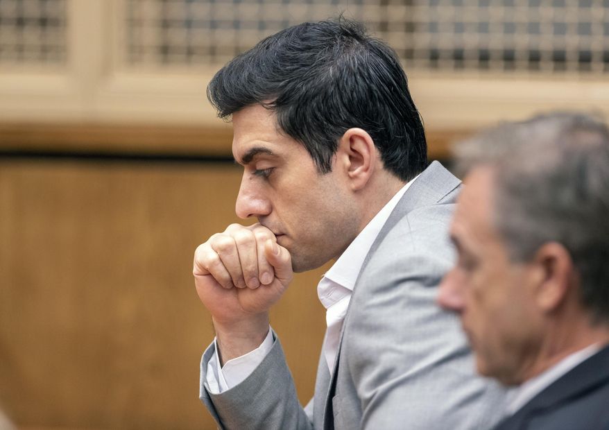 Defendant Hossein Nayeri listens to the judges' instructions before the reading of the verdict in his trial, Friday, Aug. 16, 2019 in Newport Beach, Calif. Nayeri, who previously escaped from jail and was on the run for a week was convicted Friday of kidnapping and torturing a marijuana dispensary owner who he mistakenly believed had buried large sums of money in the desert. (Paul Bersebach/The Orange County Register via AP)