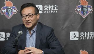 FILE - In this May 9, 2019, file photo, Joe Tsai speaks to reporters during a news conference before a WNBA exhibition basketball game between the New York Liberty and China in New York. Tsai has agreed to buy the remaining 51 percent of the Brooklyn Nets and Barclays Center from Mikhail Prokhorov in deals that two people with knowledge of the details say are worth about $3.4 billion. Terms were not disclosed Friday, Aug. 16, 2019, but the people told The Associated Press that Tsai is paying about $2.35 for the Nets — a record for a U.S. pro sports franchise — and nearly $1 billion in a separate transaction for the arena. (AP Photo/Mary Altaffer, File)