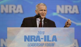 FILE - In this April 26, 2019, file photo, National Rifle Association President Col. Oliver North speaks at the National Rifle Association Institute for Legislative Action Leadership Forum at Lucas Oil Stadium in Indianapolis. New York&#39;s attorney general&#39;s office is questioning North on Tuesday, Aug. 20, 2019, as it probes whether the NRA broke laws governing its nonprofit status. (AP Photo/Michael Conroy, File)