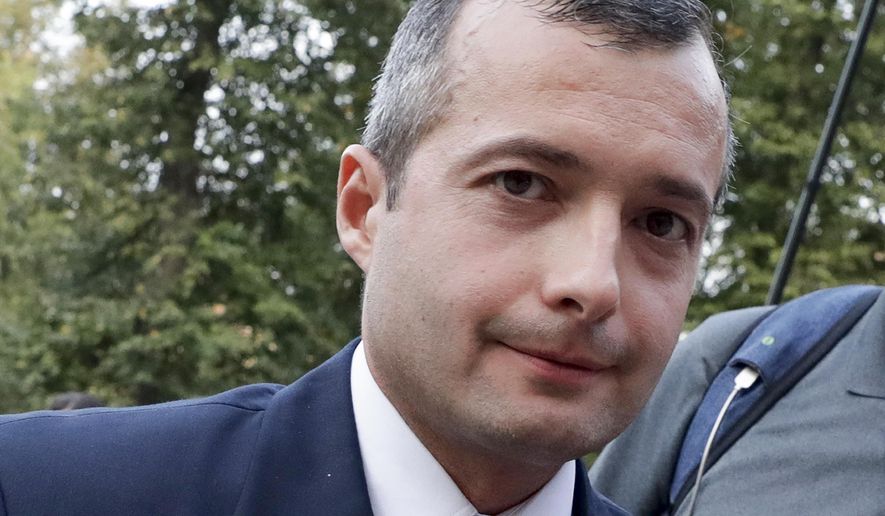 Damir Yusupov, 41, the captain of Ural Airlines A321, walks to attend a news conference in Ramenskoye, just outside Moscow, Russia, Thursday, Aug. 15, 2019. The captain of a Russian passenger jet was hailed as a hero Thursday for landing his plane in a cornfield after it collided with a flock of gulls seconds after takeoff, causing both engines to malfunction. (AP Photo/Vladimir Shatilov)