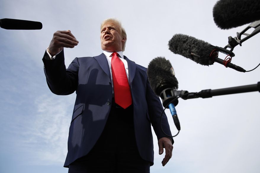 President Donald Trump speaks with reporters before boarding Air Force One at Morristown Municipal Airport in Morristown, N.J., Thursday, Aug. 15, 2019, en route to a campaign rally in Manchester, N.H. (AP Photo/Patrick Semansky)