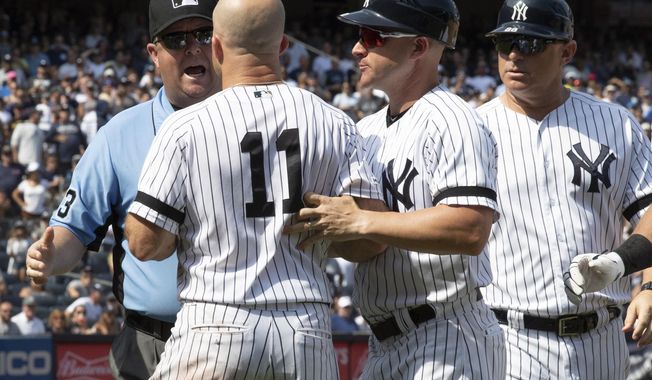 New York Yankees&#x27; Brett Gardner (11) argues with third base umpire Todd Tichenor after being ejected during the sixth inning of a baseball game against the Cleveland Indians, Saturday, Aug. 17, 2019, in New York. (AP Photo/Mary Altaffer)