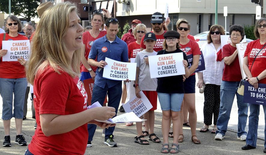 Tosha Pelfrey of Moms Demand Action speaks during a rally to protest gun violence n front of the United Building in Charleston, W.Va., Saturday, Aug. 17, 2019. (Chris Dorst/Charleston Gazette-Mail via AP)