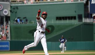 Washington Nationals&#39; Adam Eaton gestures as he celebrates his home run during the fifth inning of a baseball game against the Milwaukee Brewers, Sunday, Aug. 18, 2019, in Washington. (AP Photo/Nick Wass) **FILE**