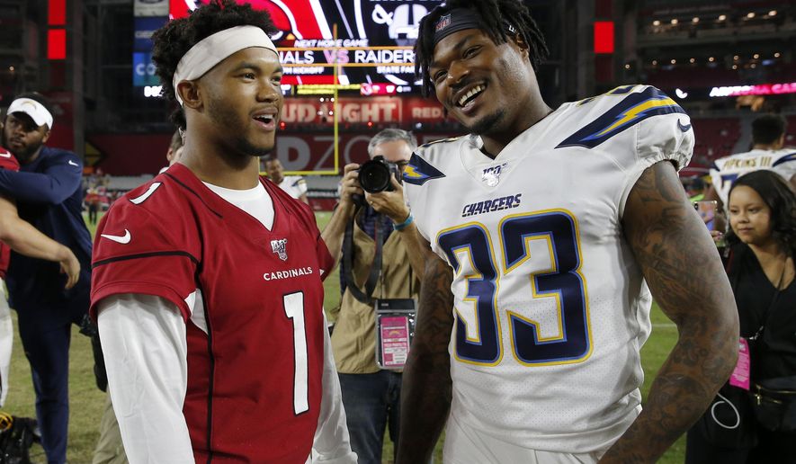 Arizona Cardinals quarterback Kyler Murray (1) greets Los Angeles Chargers free safety Derwin James (33) after an NFL preseason football game, Thursday, Aug. 8, 2019, in Glendale, Ariz. (AP Photo/Rick Scuteri)