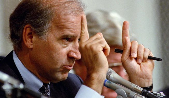 FILE - In this Oct. 12, 1991, file photo, Senate Committee Chairman Joseph Biden, D-Del., gestures during hearings before the committee on allegations of sexual harassment by Supreme Court nominee Clarence Thomas on Capitol Hill in Washington. (AP Photo/Greg Gibson, File)