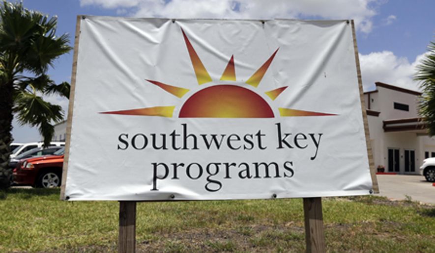 FILE - This June 20, 2014, file photo, shows a Southwest Key program sign in Brownsville, Texas. A provider of shelters for immigrant children is looking to reopen two facilities that the state of Arizona forced it to shutter last year because of issues with employee background checks and allegations of abuse. Southwest Key has filed applications to reopen a facility in downtown Phoenix and one in an outer suburb where employees were investigated for child abuse but never charged. The nonprofit filed the applications in June and July. (AP Photo/Eric Gay, File)