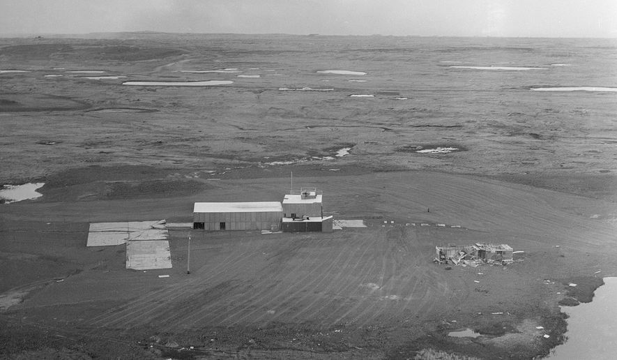 FILE - This June 1971 photo shows the facility and cement pad at ground zero on Amchitka Island, Alaska where a 1-megaton nuclear blast was detonated about 4,000 feet underground in 1969. Three U.S. underground nuclear tests were detonated on the island in the 1960s and early 1970s. An unknown volume of radioactive material remains in caverns blasted out by the detonations. Part of the island is designated a wilderness area. The island is closed to the public. (AP Photo)